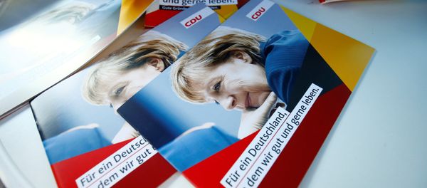 Brochures, showing German Chancellor Angela Merkel, top candidate of the Christian Democratic Union Party (CDU) are seen during an election rally for the upcoming federal elections in Gelnhausen, near Frankfurt, Germany August 14, 2017 - Sputnik International