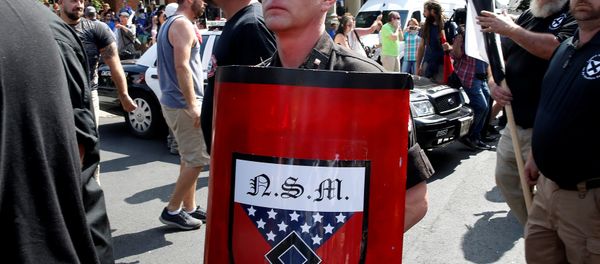 A white supremacist arrives at a rally in Charlottesville, Virginia, US, August 12, 2017. A white supremacist arrives at a rally in Charlottesville, Virginia, US, August 12, 2017. - Sputnik International