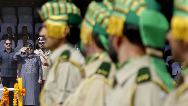Jammu and Kashmir state Chief Minister Mehbooba Mufti salutes during an Independence Day parade in Srinagar, Indian controlled Kashmir, Tuesday, Aug. 15, 2017. - Sputnik International