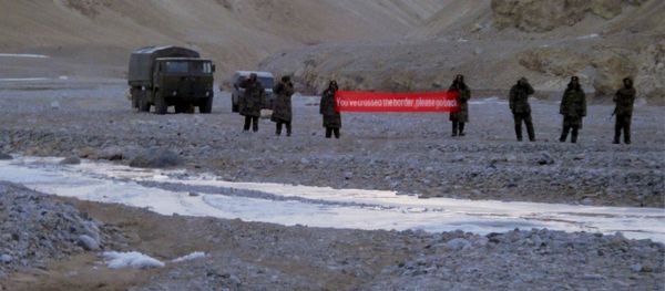 (File) In this May 5, 2013 file photo, Chinese troop hold a banner which reads, You've crossed the border, please go back, in Ladakh, India (File) In this May 5, 2013 file photo, Chinese troop hold a banner which reads, You've crossed the border, please go back, in Ladakh, India - Sputnik International