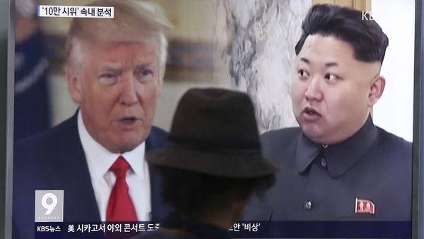 In this Aug. 10, 2017, file photo, a man watches a television screen showing U.S. President Donald Trump and North Korean leader Kim Jong-un during a news program at the Seoul Train Station in Seoul, South Korea. In this Aug. 10, 2017, file photo, a man watches a television screen showing U.S. President Donald Trump and North Korean leader Kim Jong-un during a news program at the Seoul Train Station in Seoul, South Korea. - Sputnik International