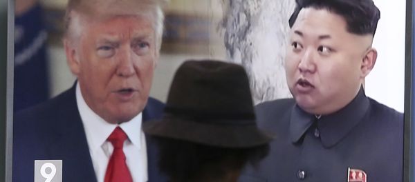 In this Aug. 10, 2017, file photo, a man watches a television screen showing U.S. President Donald Trump and North Korean leader Kim Jong-un during a news program at the Seoul Train Station in Seoul, South Korea. In this Aug. 10, 2017, file photo, a man watches a television screen showing U.S. President Donald Trump and North Korean leader Kim Jong-un during a news program at the Seoul Train Station in Seoul, South Korea. - Sputnik International
