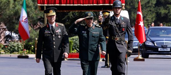 Turkish Chief of Staff General Hulusi Akar and his Iranian counterpart Major General Mohammad Baqeri review the guards of honour during a welcoming ceremony in Ankara, Turkey, August 15, 2017 - Sputnik International