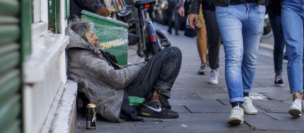 A group of people walks past homeless people on Broadway Market in east London on July 23, 2017 A group of people walks past homeless people on Broadway Market in east London on July 23, 2017 - Sputnik International