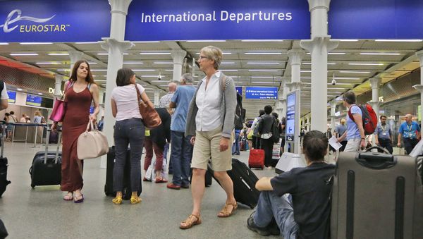 In this Thursday, July 2, 2015 file photo, people queue as they wait at the St. Pancras international train station terminal in London In this Thursday, July 2, 2015 file photo, people queue as they wait at the St. Pancras international train station terminal in London - Sputnik International