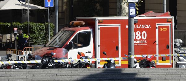 A policeman stands next to an ambulance after a van ploughed into the crowd, injuring several persons on the Rambla in Barcelona on August 17, 2017 A policeman stands next to an ambulance after a van ploughed into the crowd, injuring several persons on the Rambla in Barcelona on August 17, 2017 - Sputnik International