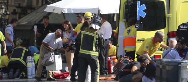 Injured people are treated in Barcelona, Spain, Thursday, Aug. 17, 2017 after a white van jumped the sidewalk in the historic Las Ramblas district, crashing into a summer crowd of residents and tourists and injuring several people, police said. - Sputnik International