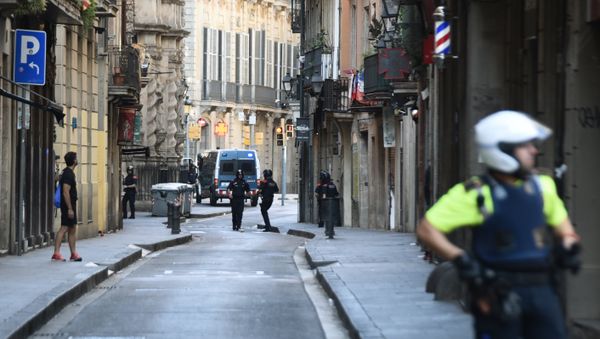 Police secure the area close to the scene after a white van jumped the sidewalk in the historic Las Ramblas district of Barcelona, Spain, crashing into a summer crowd of residents and tourists Thursday, Aug. 17, 2017. - Sputnik International
