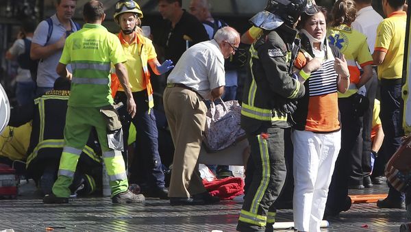 Injured people are treated in Barcelona, Spain, Thursday, Aug. 17, 2017 after a white van jumped the sidewalk in the historic Las Ramblas district, crashing into a summer crowd of residents and tourists and injuring several people, police said. Injured people are treated in Barcelona, Spain, Thursday, Aug. 17, 2017 after a white van jumped the sidewalk in the historic Las Ramblas district, crashing into a summer crowd of residents and tourists and injuring several people, police said. - Sputnik International