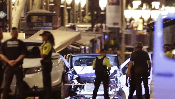 Police officers stand next to the van involved on an attack in Las Ramblas in Barcelona, Spain, Thursday, Aug. 17, 2017. Police officers stand next to the van involved on an attack in Las Ramblas in Barcelona, Spain, Thursday, Aug. 17, 2017. - Sputnik International