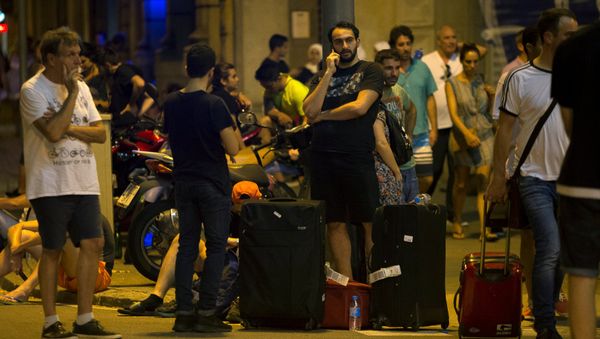 People wait to enter the area after a van crashed into pedestrians near the Las Ramblas avenue in central Barcelona, Spain August 17, 2017 People wait to enter the area after a van crashed into pedestrians near the Las Ramblas avenue in central Barcelona, Spain August 17, 2017 - Sputnik International