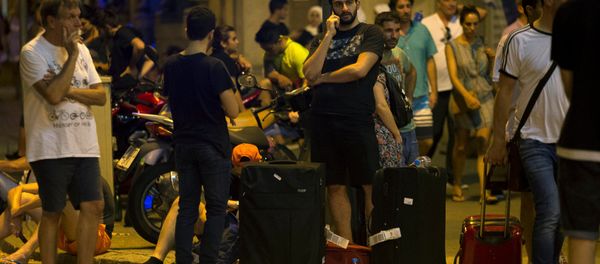 People wait to enter the area after a van crashed into pedestrians near the Las Ramblas avenue in central Barcelona, Spain August 17, 2017 People wait to enter the area after a van crashed into pedestrians near the Las Ramblas avenue in central Barcelona, Spain August 17, 2017 - Sputnik International