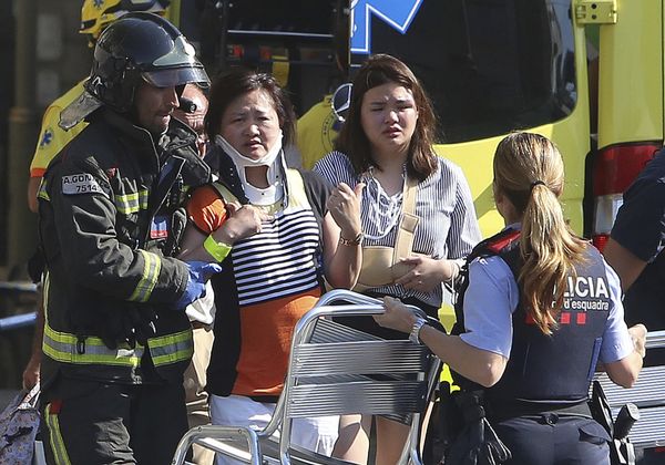 Injured people are treated in Barcelona, Spain, Thursday, Aug. 17, 2017 after a white van jumped the sidewalk in the historic Las Ramblas district, crashing into a summer crowd of residents and tourists and injuring several people, police said Injured people are treated in Barcelona, Spain, Thursday, Aug. 17, 2017 after a white van jumped the sidewalk in the historic Las Ramblas district, crashing into a summer crowd of residents and tourists and injuring several people, police said - Sputnik International