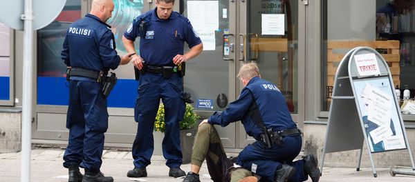 Police officers stand next to a person lying on the pavement in the Finnish city of Turku where several people were stabbed on August 18, 2017 Police officers stand next to a person lying on the pavement in the Finnish city of Turku where several people were stabbed on August 18, 2017 - Sputnik International