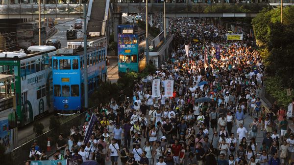 Demonstrators march in protest of the jailing of student leaders Joshua Wong, Nathan Law and Alex Chow, who were imprisoned for their participation of the 2014 pro-democracy Umbrella Movement, also known as Occupy Central protests, in Hong Kong China August 20, 2017 Demonstrators march in protest of the jailing of student leaders Joshua Wong, Nathan Law and Alex Chow, who were imprisoned for their participation of the 2014 pro-democracy Umbrella Movement, also known as Occupy Central protests, in Hong Kong China August 20, 2017 - Sputnik International