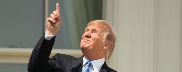 President Donald Trump points skyward before donning protective glasses to view the solar eclipse, Monday, Aug. 21, 2017, at the White House in Washington . President Donald Trump points skyward before donning protective glasses to view the solar eclipse, Monday, Aug. 21, 2017, at the White House in Washington . - Sputnik International