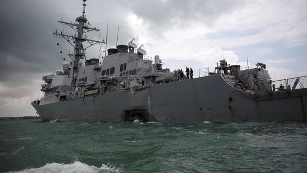 The U.S. Navy guided-missile destroyer USS John S. McCain is seen after a collision, in Singapore waters August 21, 2017 - Sputnik International