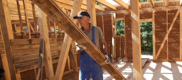 Construction of wooden houses. File photo Construction of wooden houses. File photo - Sputnik International