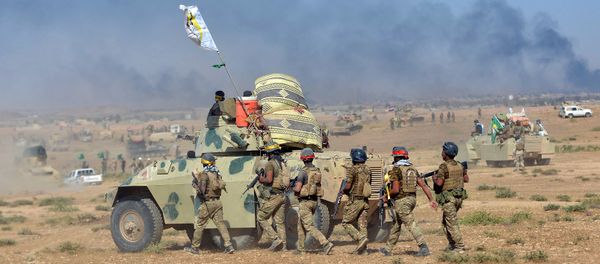 Shi'ite Popular Mobilization Forces (PMF) gather with Iraqi army on the outskirts of Tal Afar, Iraq, August 22, 2017 Shi'ite Popular Mobilization Forces (PMF) gather with Iraqi army on the outskirts of Tal Afar, Iraq, August 22, 2017 - Sputnik International