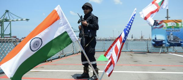 An Indian Navy sailor stands guard on the deck of the INS Shivalik during the inauguration of joint naval exercises with the United States and Japan in Chennai on July 10, 2017 - Sputnik International