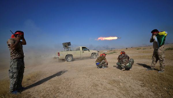 Shi'ite Popular Mobilization Forces (PMF) launch a rocket towards Islamic State militants on the outskirts of Tal Afar, Iraq, August 22, 2017 - Sputnik International