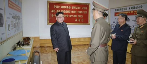 In this image made from video of a news bulletin aired by North Korea's KRT on Wednesday, Aug. 23, 2017, leader Kim Jong Un visits the Chemical Material Institute of Academy of Defense Science at an undisclosed location in North Korea. North Korea's state media released photos that appear to show concept diagrams of the missiles hanging on a wall behind leader Kim Jong Un, one showing a diagram for a missile called Pukguksong-3. Independent journalists were not given access to cover the event depicted in this photo. - Sputnik International