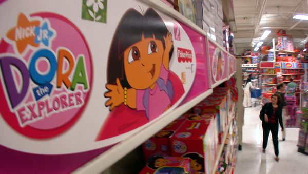 An unidentified shopper walks past a Dora the Explorer display at a Toys-R-Us store Thursday, Dec. 15, 2005 in Doral, Fla. - Sputnik International