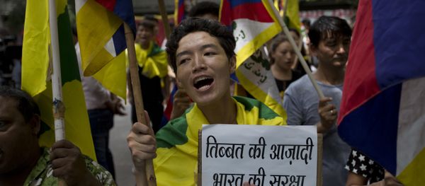 Exile Tibetans shout slogans during a protest to show support with India on Doklam standoff in New Delhi, India, Friday, Aug. 11, 2017 Exile Tibetans shout slogans during a protest to show support with India on Doklam standoff in New Delhi, India, Friday, Aug. 11, 2017 - Sputnik International