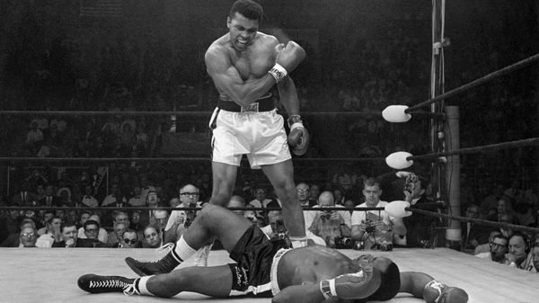 In this May 25, 1965 file photo, heavyweight champion Muhammad Ali stands over fallen challenger Sonny Liston, shouting and gesturing shortly after dropping Liston with a short hard right to the jaw, in Lewiston, Maine. The bout lasted only one minute into the first round. Ali is the only man ever to win the world heavyweight boxing championship three times. In this May 25, 1965 file photo, heavyweight champion Muhammad Ali stands over fallen challenger Sonny Liston, shouting and gesturing shortly after dropping Liston with a short hard right to the jaw, in Lewiston, Maine. The bout lasted only one minute into the first round. Ali is the only man ever to win the world heavyweight boxing championship three times. - Sputnik International