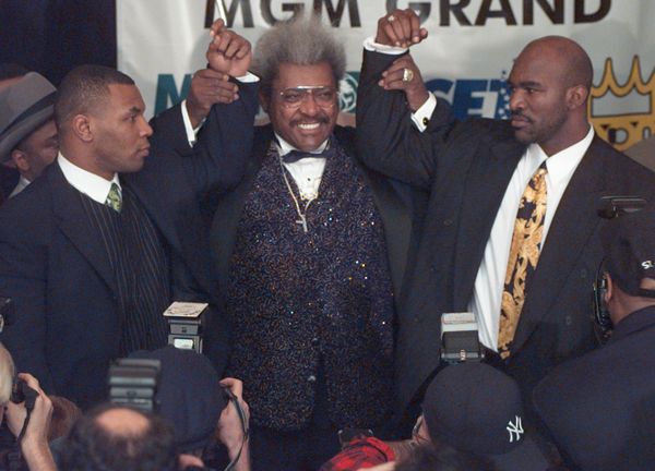 Heavyweight boxer Mike Tyson, left, appears at a news conference to promote his heavyweight title rematch against World Boxing Association heavyweight champion Evander Holyfield, right, Monday February 3 1997 in New York. The fight, announced by promoter Don King, center, took place June 28 1997 at the MGM Grand Hotel/Casino in Las Vegas - Sputnik International