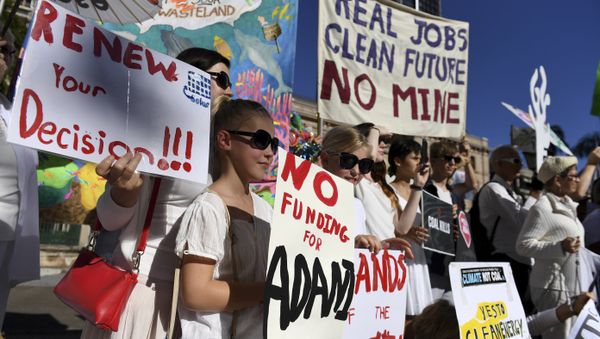 In this May 25, 2017 photo, environmental activists voice their opposition to Indian miner Adani's proposed Carmichael coal mine, outside Parliament House in Brisbane, Australia In this May 25, 2017 photo, environmental activists voice their opposition to Indian miner Adani's proposed Carmichael coal mine, outside Parliament House in Brisbane, Australia - Sputnik International