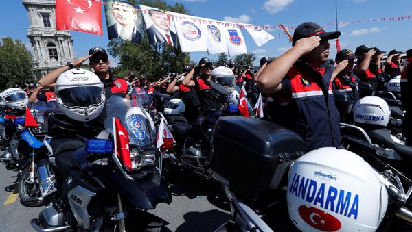 Gendarmerie and police officers salute as Turkish President Tayyip Erdogan (not pictured) arrives at a ceremony in Istanbul, Turkey, August 25, 2017 - Sputnik International