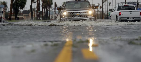 A truck drives moves through flood waters left behind by Hurricane Harvey, Saturday, Aug. 26, 2017, in Aransas Pass, Texas. A truck drives moves through flood waters left behind by Hurricane Harvey, Saturday, Aug. 26, 2017, in Aransas Pass, Texas. - Sputnik International