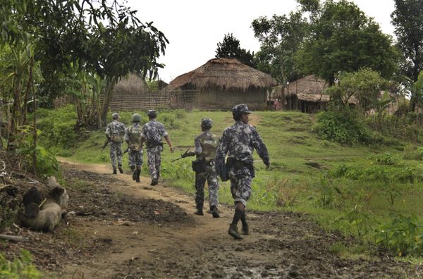 In this Friday, July 14, 2017 photo, Myanmar Border Guard Police (BGP) officers walk along a path ahead of journalists in Tin May village, in which Myanmar government and military claim the existence of Muslim terrorists in Buthidaung, Rakhine State, Myanmar. In this Friday, July 14, 2017 photo, Myanmar Border Guard Police (BGP) officers walk along a path ahead of journalists in Tin May village, in which Myanmar government and military claim the existence of Muslim terrorists in Buthidaung, Rakhine State, Myanmar. - Sputnik International