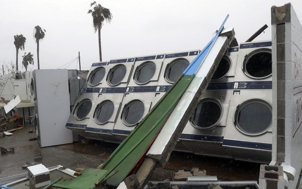 Clothes dryers are exposed to the elements after a laundromat lost its roof and portions of walls in the wake of Hurricane Harvey. Clothes dryers are exposed to the elements after a laundromat lost its roof and portions of walls in the wake of Hurricane Harvey. - Sputnik International