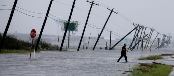A man walks through floods waters and onto the main road after surveying his property which was hit by Hurricane Harvey in Rockport, Texas, U.S. August 26, 2017. A man walks through floods waters and onto the main road after surveying his property which was hit by Hurricane Harvey in Rockport, Texas, U.S. August 26, 2017. - Sputnik International