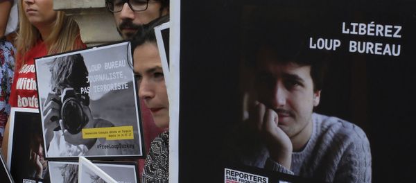 Activists from Reporters Without Borders carry posters in a show of support to French freelance journalist Loup Bureau Activists from Reporters Without Borders carry posters in a show of support to French freelance journalist Loup Bureau - Sputnik International