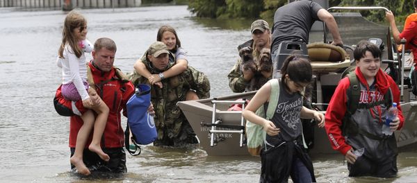 Residents are rescued from their homes surrounded by floodwaters from Tropical Storm Harvey on Sunday, Aug. 27, 2017, in Houston, Texas. Residents are rescued from their homes surrounded by floodwaters from Tropical Storm Harvey on Sunday, Aug. 27, 2017, in Houston, Texas. - Sputnik International