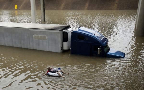 A man floats past a truck submerged on a freeway flooded by Tropical Storm Harvey on Sunday, Aug. 27, 2017, near downtown Houston. A man floats past a truck submerged on a freeway flooded by Tropical Storm Harvey on Sunday, Aug. 27, 2017, near downtown Houston. - Sputnik International