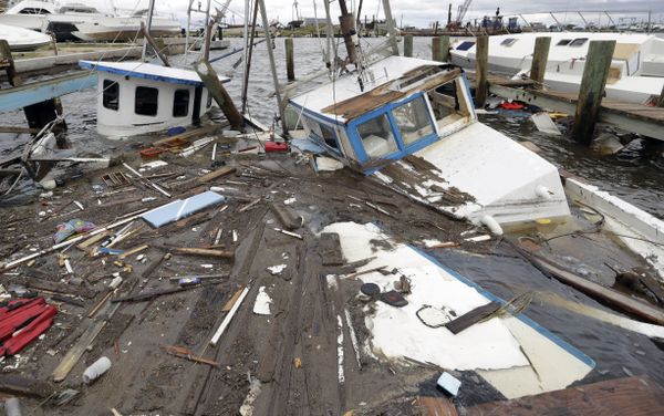 Boats that sunk in the wake of Hurricane Harvey are surrounded by floating debris Sunday, Aug. 27, 2017, in Rockport, Texas. Boats that sunk in the wake of Hurricane Harvey are surrounded by floating debris Sunday, Aug. 27, 2017, in Rockport, Texas. - Sputnik International