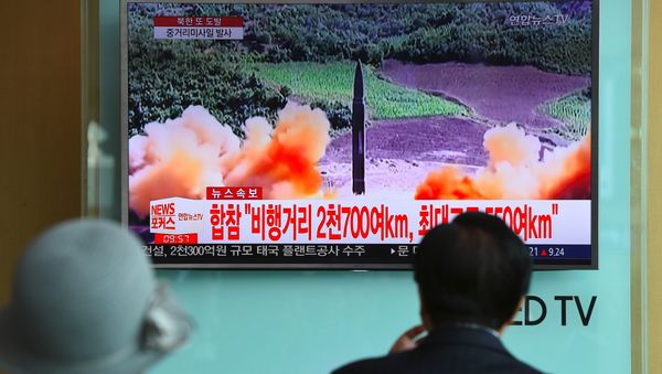 People watch a television news screen showing file footage of a North Korean missile launch, at a railway station in Seoul on August 29, 2017. People watch a television news screen showing file footage of a North Korean missile launch, at a railway station in Seoul on August 29, 2017. - Sputnik International