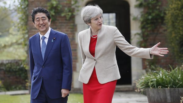 Britain's Prime Minister Theresa May shows Prime Minister Shinzo Abe of Japan around the garden at Chequers near Wendover, England, Friday, April 28, 2017. Britain's Prime Minister Theresa May shows Prime Minister Shinzo Abe of Japan around the garden at Chequers near Wendover, England, Friday, April 28, 2017. - Sputnik International