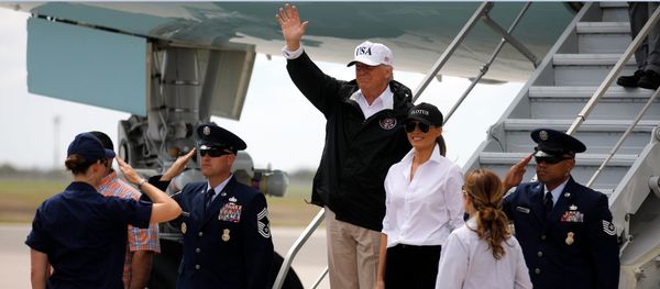 U.S. President Donald Trump (C) waves next to first lady Melania Trump upon arrival prior to receiving a briefing on Tropical Storm Harvey relief efforts in Corpus Christi, Texas, U.S U.S. President Donald Trump (C) waves next to first lady Melania Trump upon arrival prior to receiving a briefing on Tropical Storm Harvey relief efforts in Corpus Christi, Texas, U.S - Sputnik International