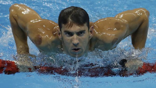 United States' Michael Phelps leaves the pool after winning a heat of the men's 200-meter individual medley during the swimming competitions at the 2016 Summer Olympics, Wednesday, Aug. 10, 2016, in Rio de Janeiro, Brazil. (File) - Sputnik International