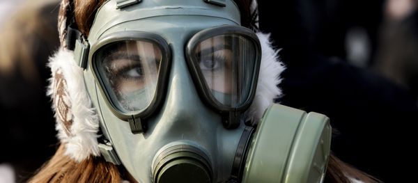 A woman wearing a gas mask participates in a protest against air pollution in Skopje, Macedonia, on Saturday, Dec. 21, 2013. A woman wearing a gas mask participates in a protest against air pollution in Skopje, Macedonia, on Saturday, Dec. 21, 2013. - Sputnik International