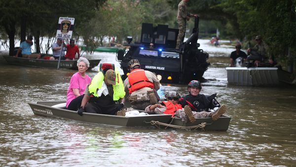 A rescue boat evacuates people from the rising waters of Buffalo Bayou following Hurricane Harvey in a neighborhood west of Houston, Texas, U.S., August 30, 2017 A rescue boat evacuates people from the rising waters of Buffalo Bayou following Hurricane Harvey in a neighborhood west of Houston, Texas, U.S., August 30, 2017 - Sputnik International