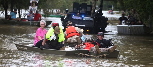 A rescue boat evacuates people from the rising waters of Buffalo Bayou following Hurricane Harvey in a neighborhood west of Houston, Texas, U.S., August 30, 2017 - Sputnik International