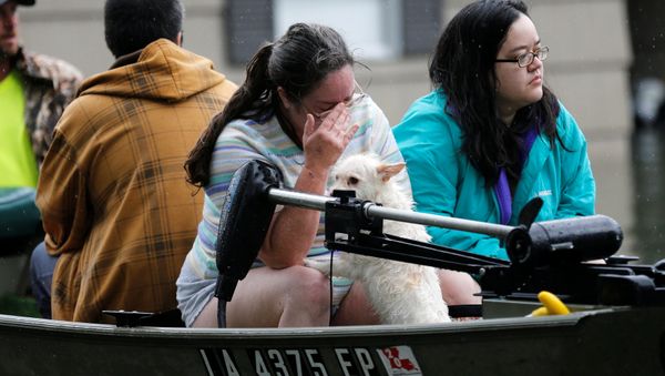A woman is overcome with grief after being rescued from her home flooded by Tropical Storm Harvey in Orange, Texas, U.S., August 30, 2017. A woman is overcome with grief after being rescued from her home flooded by Tropical Storm Harvey in Orange, Texas, U.S., August 30, 2017. - Sputnik International