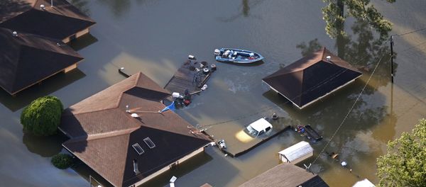 A boat sits near flooded homes in the aftermath of Tropical Storm Harvey in Beaumont, Texas, Thursday, Aug. 31, 2017. - Sputnik International