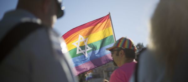 Israeli police officers watch as people take part in the annual gay pride parade in central Jerusalem, Thursday, July 21, 2016. Israeli police officers watch as people take part in the annual gay pride parade in central Jerusalem, Thursday, July 21, 2016. - Sputnik International